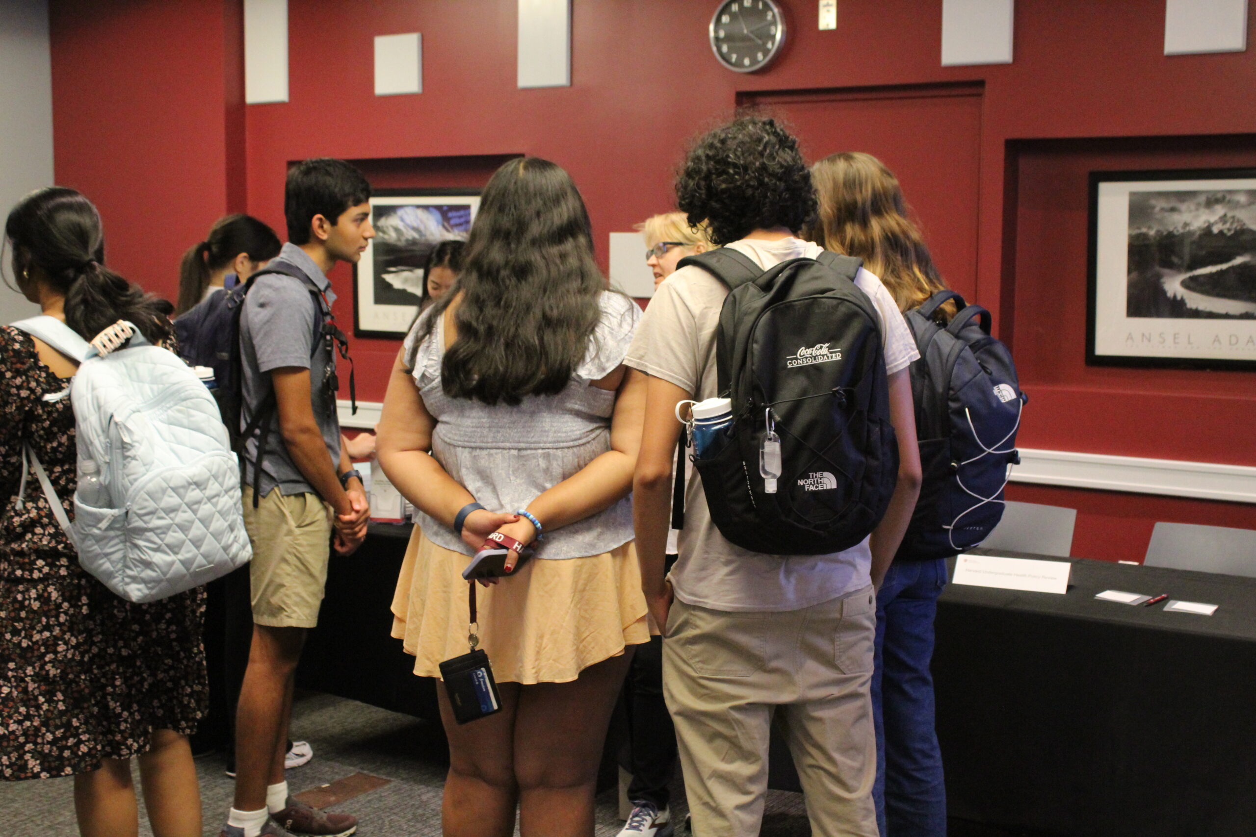Group of students around a table at the Fall Open House.