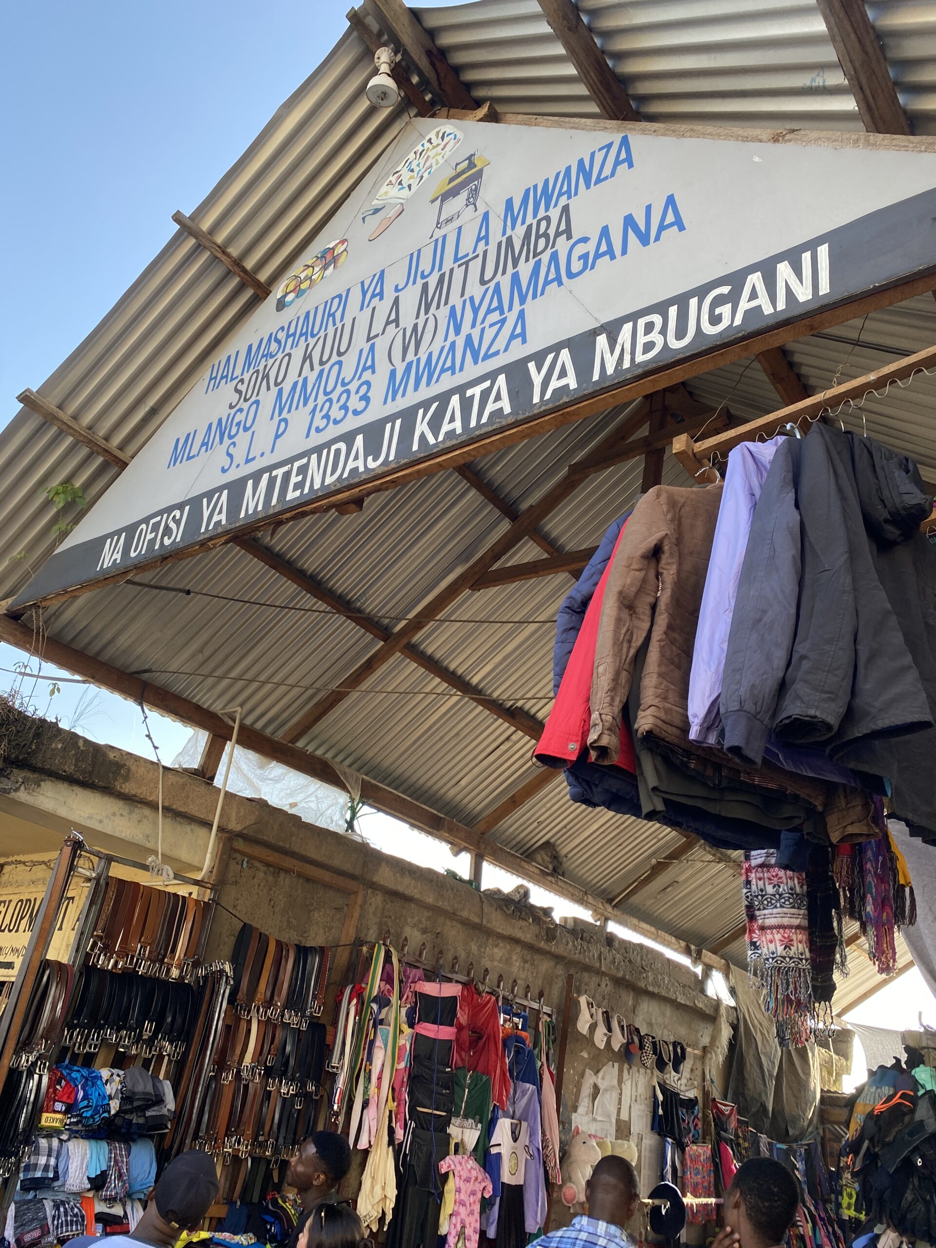 Picture of a market with clothes on a stand