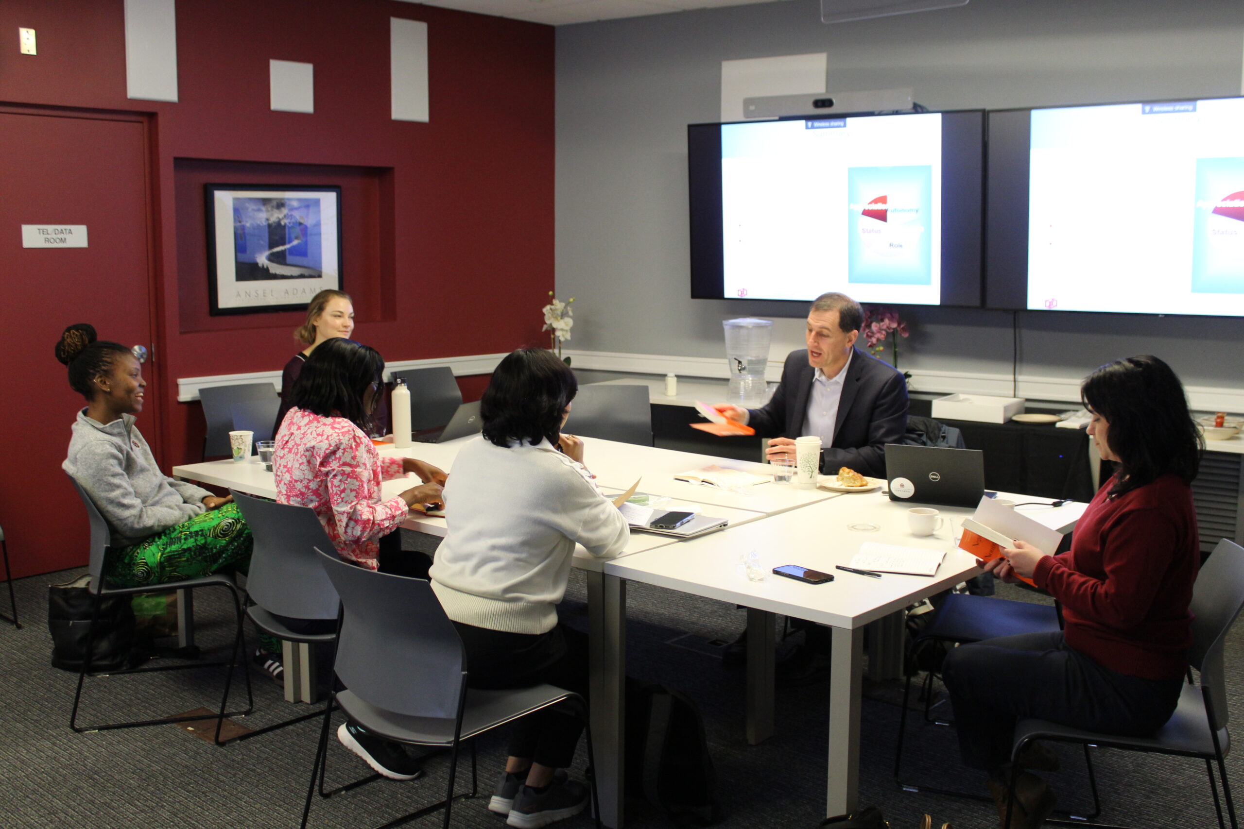 LEAD Fellows at a workshop around a large conference table