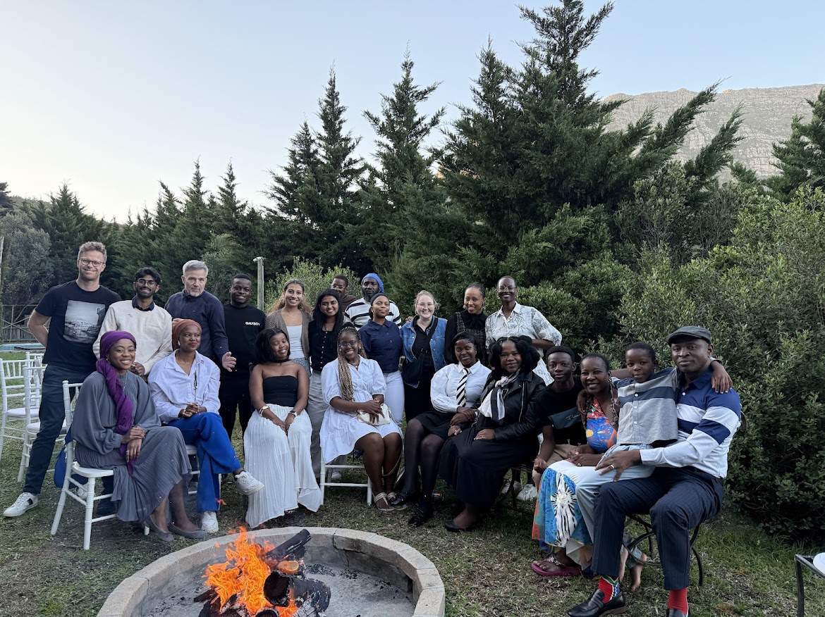 Group of people around a fire.