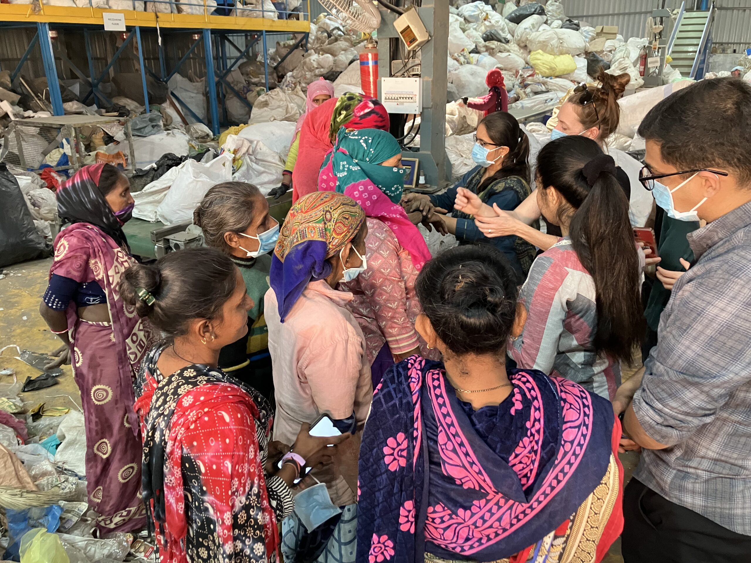 The Harvard team visits a ware recycling plant to understand the thermal comfort challenges the women face.
