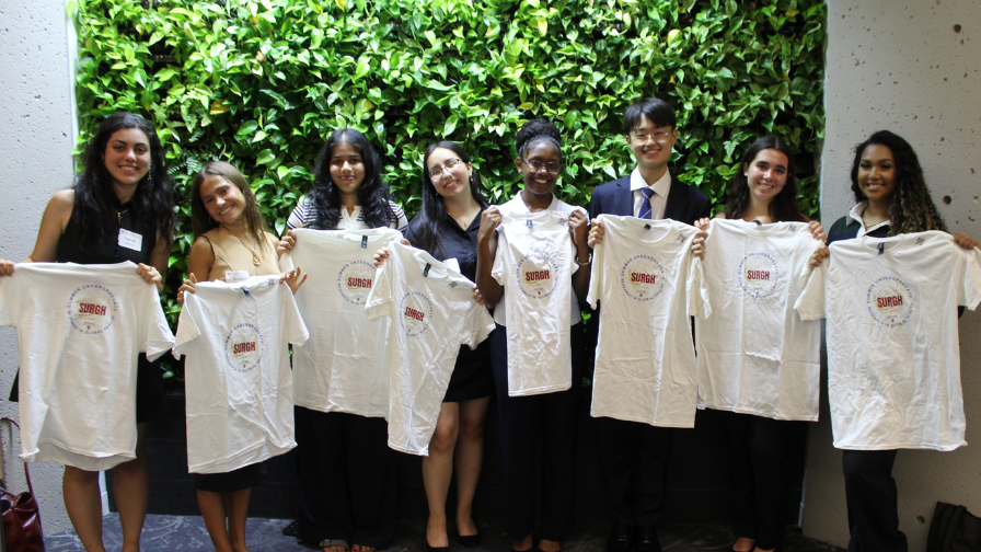 2026 SURGH Student Interns holding up internship tshirts posing for a picture.