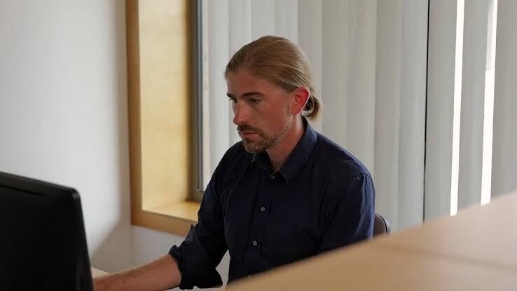 John Naslund Working on Laptop
