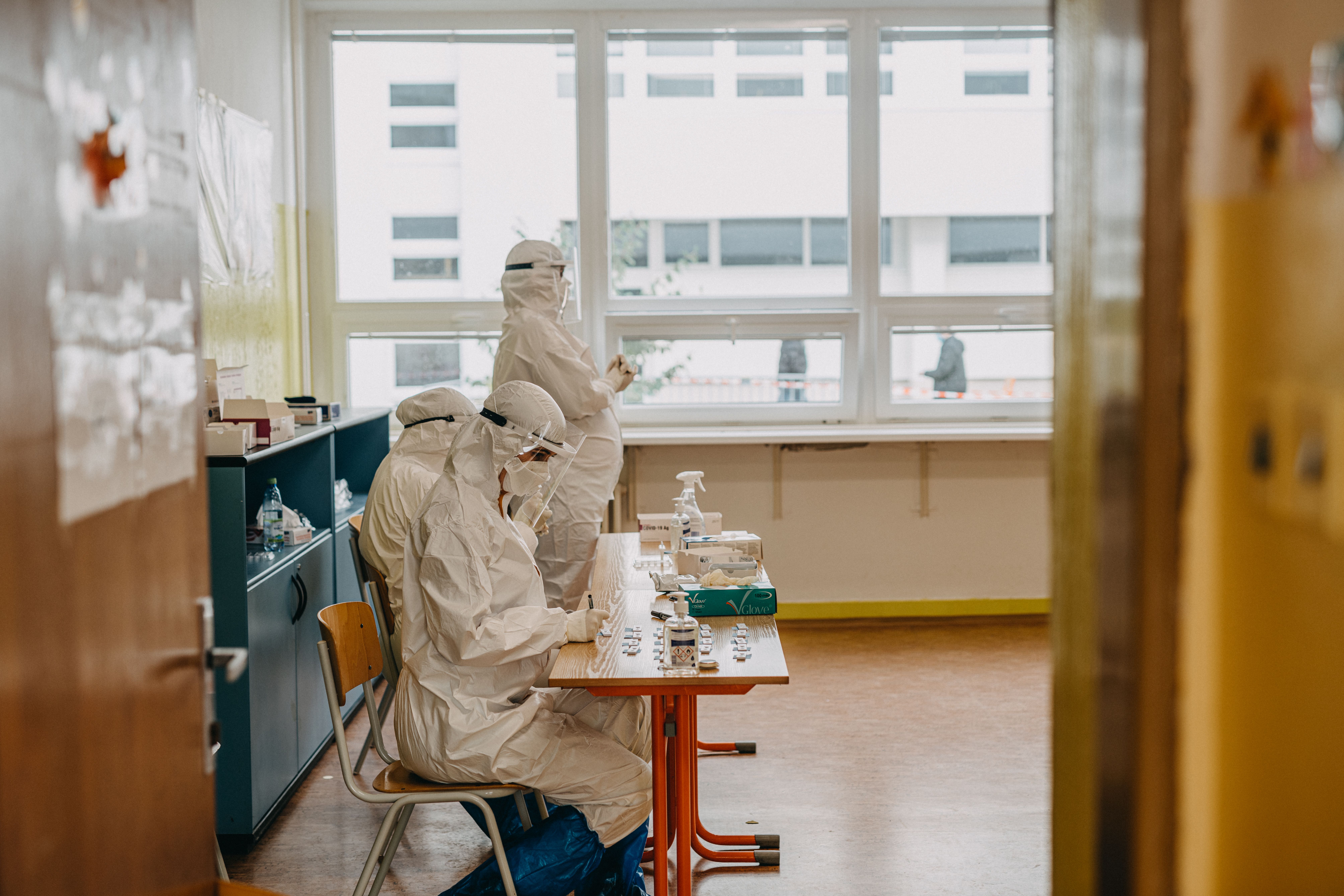 Medical professionals in PPE working in a health facility amidst the pandemic.